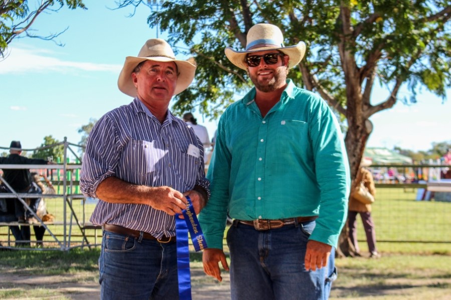 Judge Luke Carrington presents Stuart Christensen with Best Herd Bull under 24mo